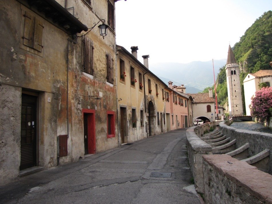 old constructed houses along a tiny road