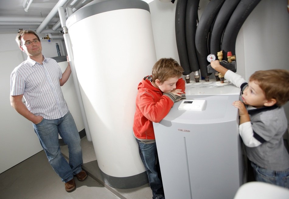 children near heat pumps in the basement