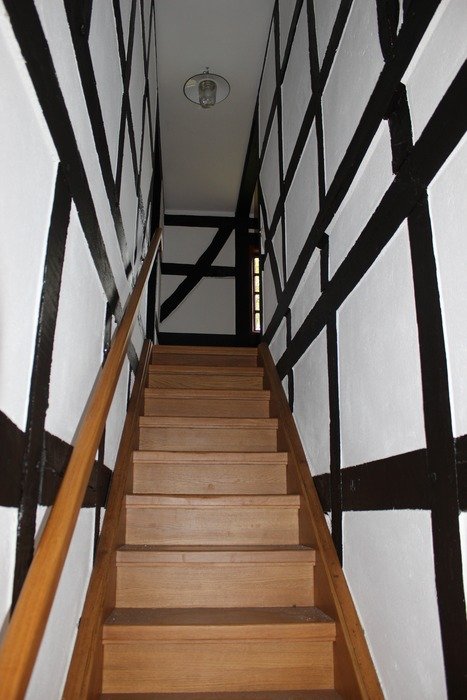 High wooden staircase in the building