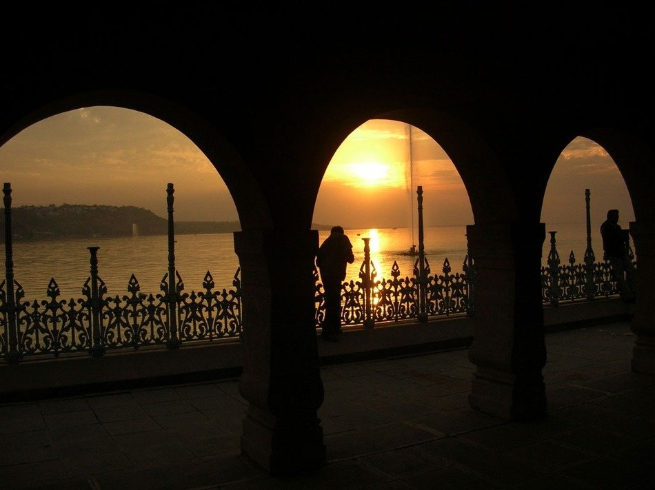 arcade and lake at sunset