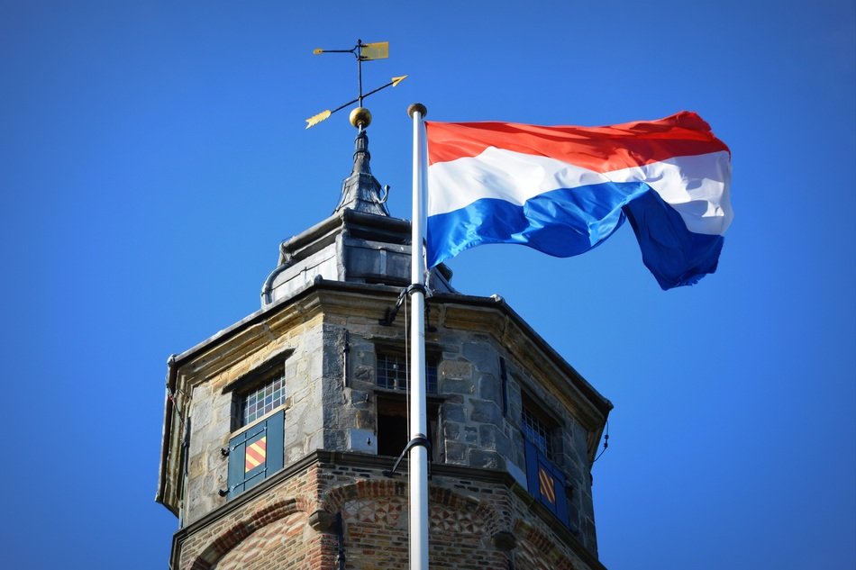 dutch flag on a stone tower