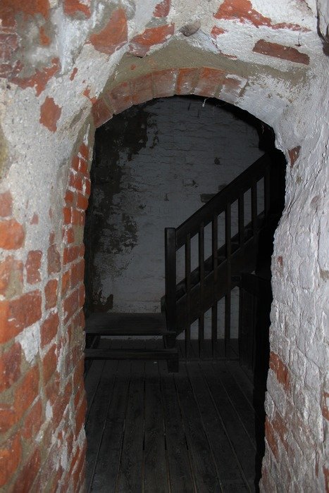 arched entrance in front of the stairs