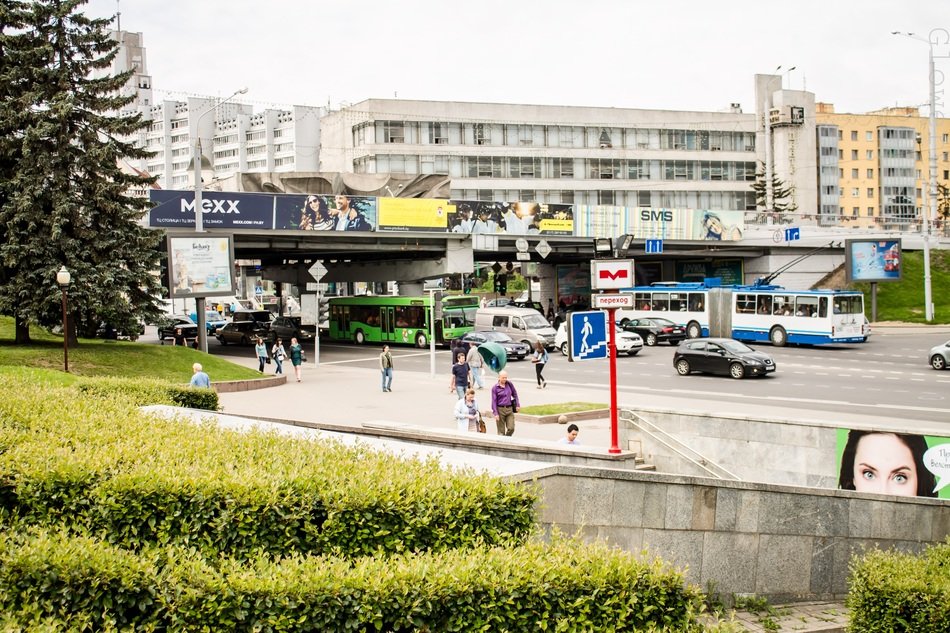 Entrance to the metro on the background of the cityscape of Minsk