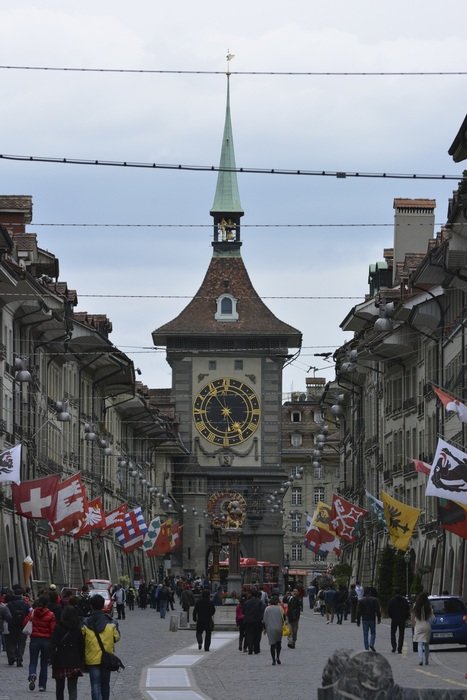 people walk along an alley in Bern