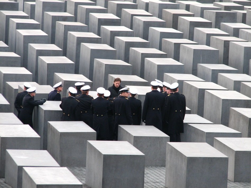 People on the holocaust memorial in berlin