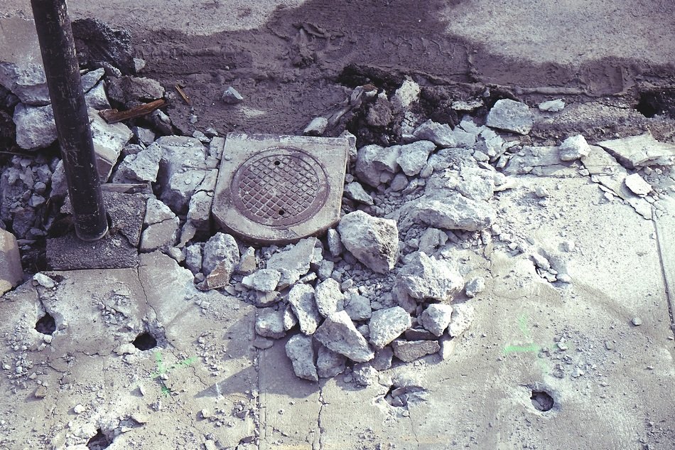 destroyed sidewalk and sunroof