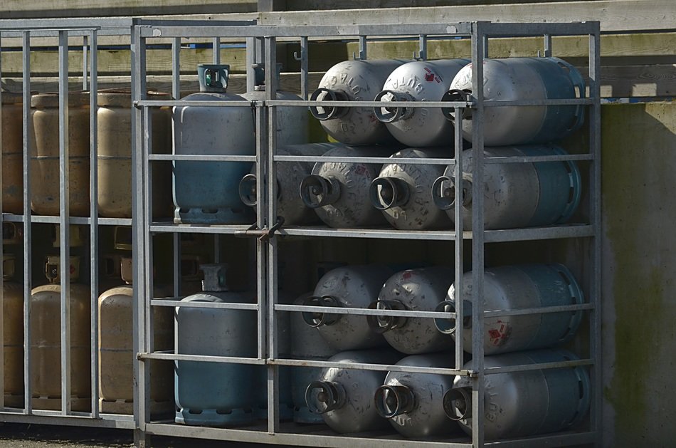 gas bottles at gridded shelves