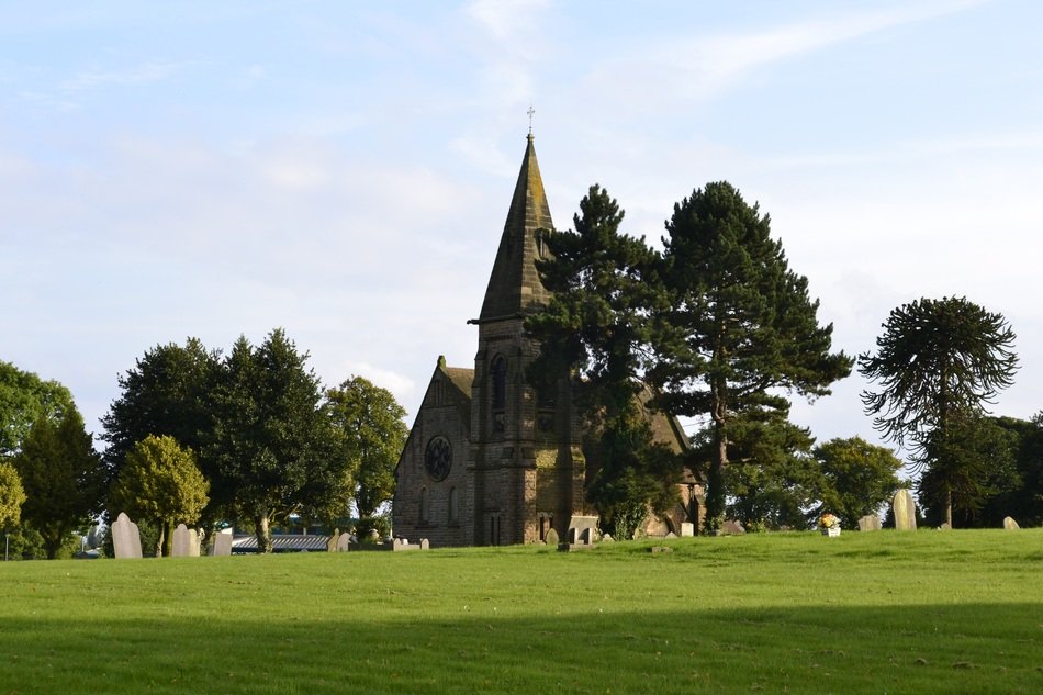 green lawn, cemetery and church