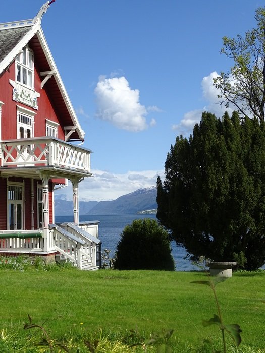 solitary house among the plants by the lake in Norway