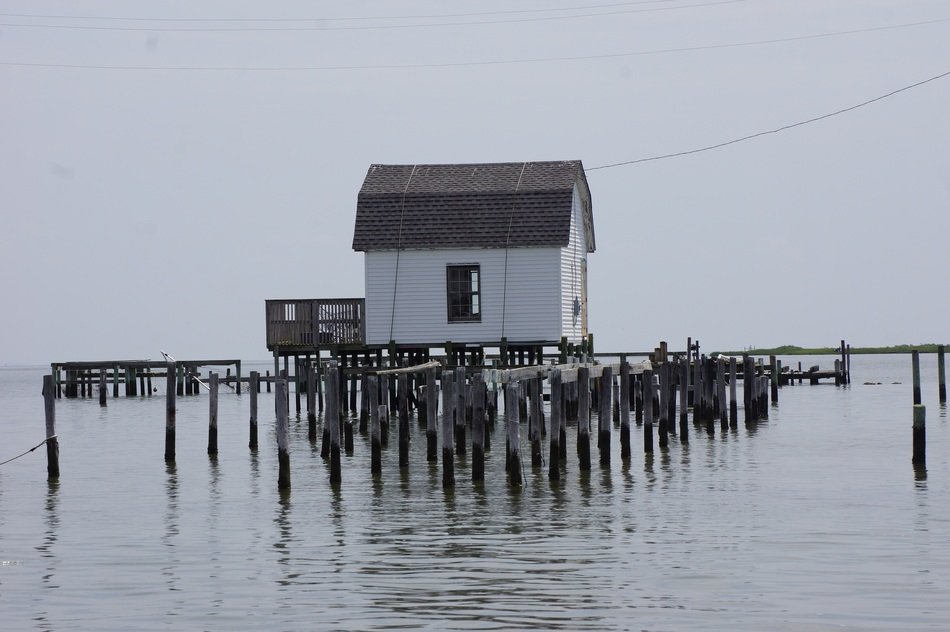 small wooden house on the lake