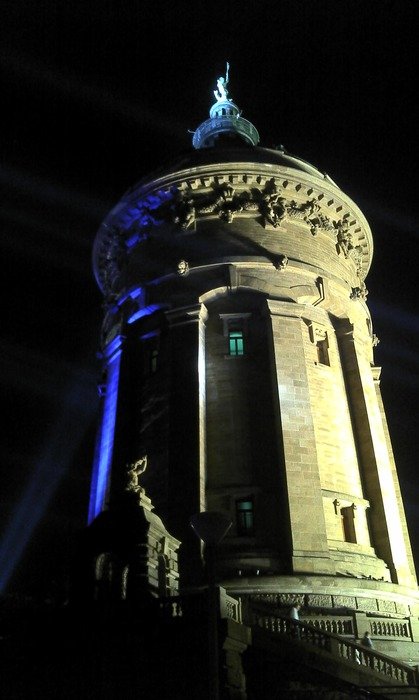 High water tower at night