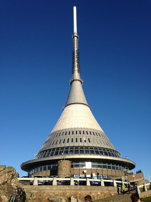 Ještěd telecommunication Tower with hotel in lowest sections at sky, czech