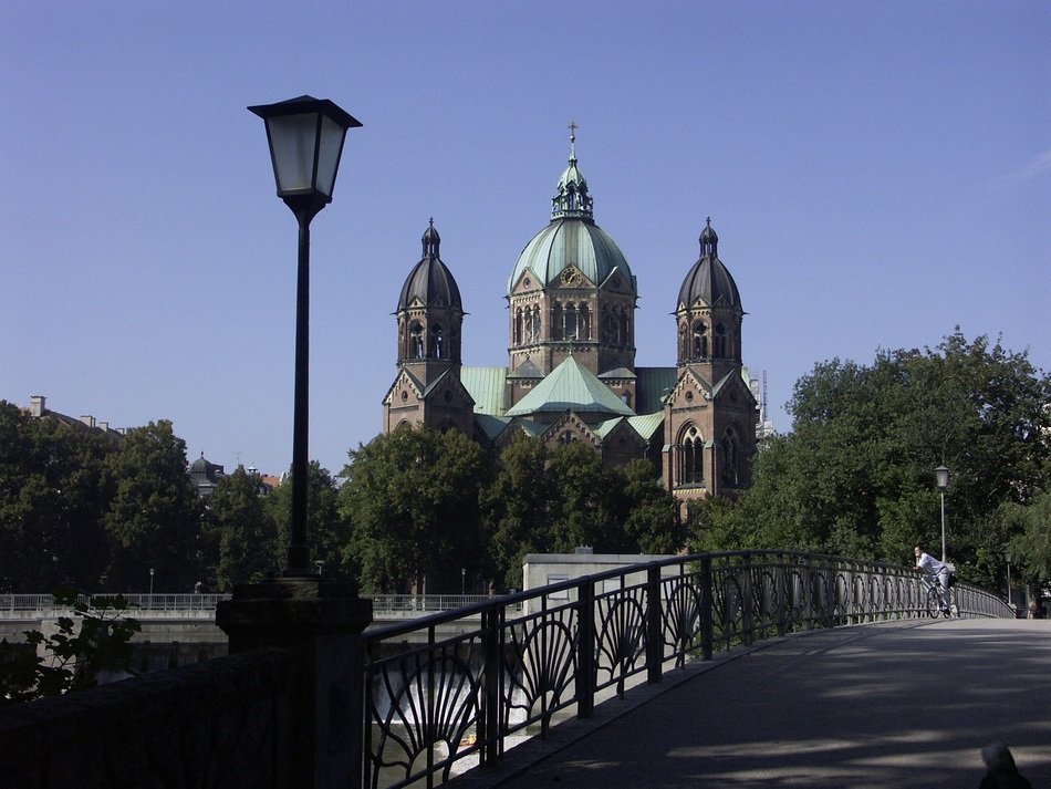 bridge on the background of the church in Munich