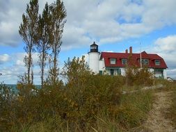 lighthouse near a lake in michigan