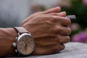 clock on male hands