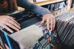 Girl in the choice of vinyl records