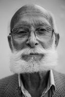 old man with beard in black and white