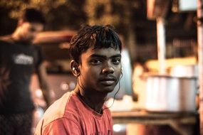 black teenage boy with earphones