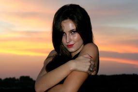 seductive girl on a sunset background