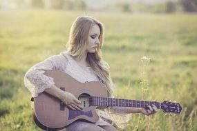 young woman play country guitar