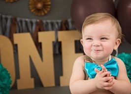 Little child eating cake birthdate