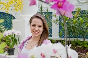 Portrait of beauty girl is in a garden
