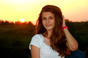 portrait of a girl on the sunset background