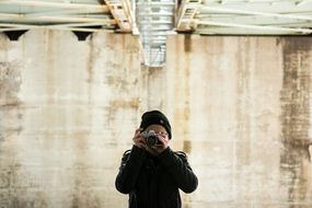 photographer in black hat