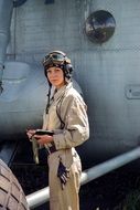 girl navigator pilot in military clothes