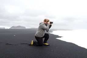 Cameraman on seashore