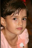 portrait of a child with an innocent expression on his face