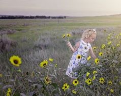 child and sunflower