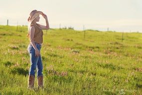 country girl on the summer meadow