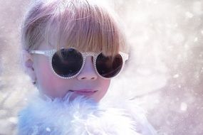 blond girl child in the snow