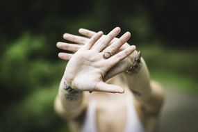 girl hipster hiding face by hands
