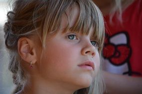 portrait of a blond girl with braids
