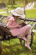 young girl reading in the garden
