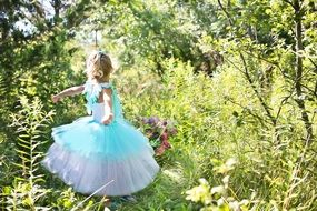 little girl in the summer forest