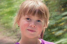 blond child smiling