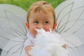 baby in white angel costume