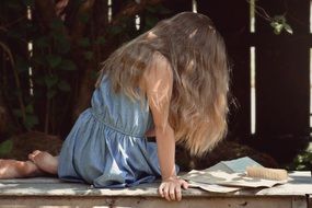 blond girl reading letters