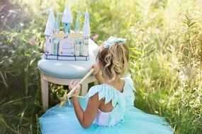 girl and toy castle