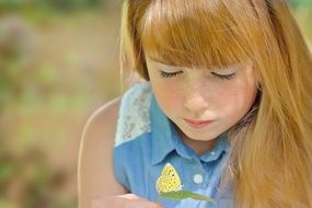 child girl with butterfly