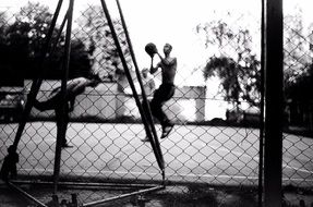 black and white photo of basketball athletes