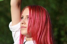 Portrait of incredibly beautiful girl with pink hair