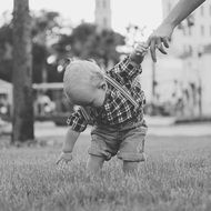 black and white photo of a child outdoors