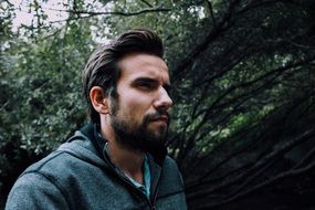 beard young man looking away