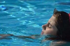 girl swimming in pool