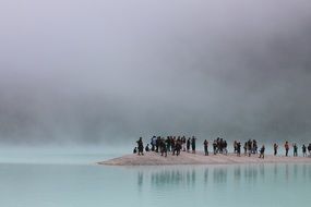 group of tourists on an island on a cloudy day