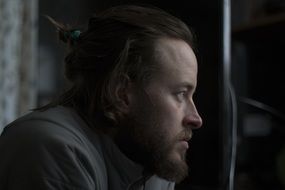 man with tail and beared